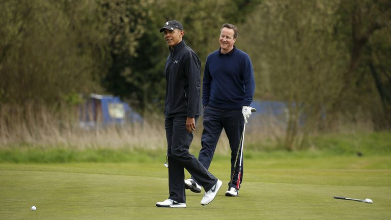 U.S. President Barack Obama and British Prime Minister David Cameron smile after Obama missed a putt during a round of golf at The Grove golf course in Watford, England April 23, 2016.REUTERS/Kevin Lamarque