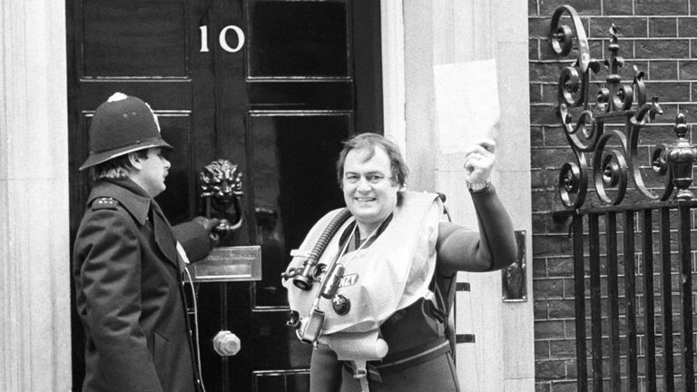 The Shadow Transport Secretary John Prescott holds up a letter for the Prime Minister Margaret Thatcher as part of a protest against the government's policy of dumping nuclear waste. He had swum two miles down the Thames from Chelsea to Westminster Bridge as part of the protest.