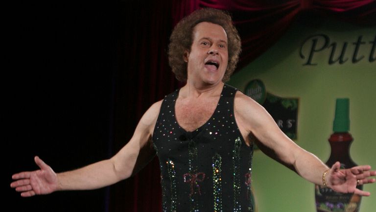 June 2, 2006, file photo, Richard Simmons speaks to the audience before the start of a summer salad fashion show at Grand Central Terminal in New York. Simmons publicist Tom Estey denied a claim by Simmons' former former masseuse and friend Mauro Oliveira that Simmons is being controlled by his housekeeper. Estey tells People magazine for an article published March 6, 2017, that Simmons has made a choice “to live a more private life.” (AP Photo/Tina Fineberg, File)