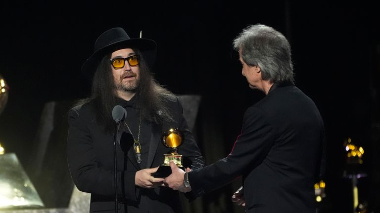 Sean Ono Lennon, left, accepts the award for best rock performance  from producer Bob Clearmountain, for Now And Then on behalf of The Beatles, during the 2025 Grammy Awards. Pic: AP/Chris Pizzello