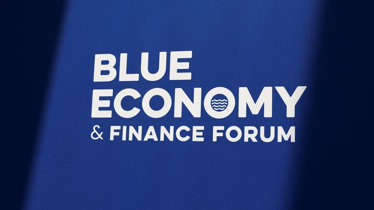 Logo Blue Economy and Finance Forum - bílé psaní na modrém pozadí.  Pic: Reuters