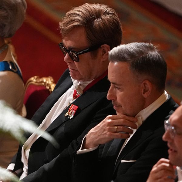 Elton John a David poskytují na státní banketu na hradu Windsor. Pic: PA Square