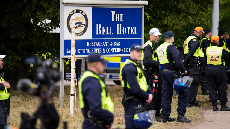 Policisté před demonstrací mimo hotel Bell v červenci. Pic: Pa