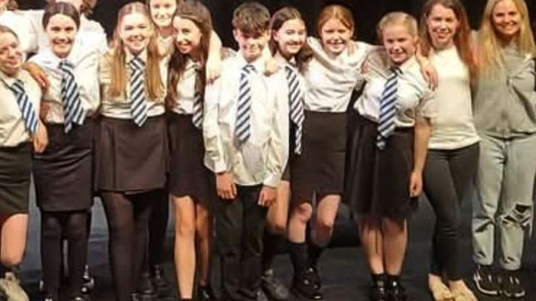 Cooper se svými kamarády třídy Drama School. Pic: Drama Mob/PA