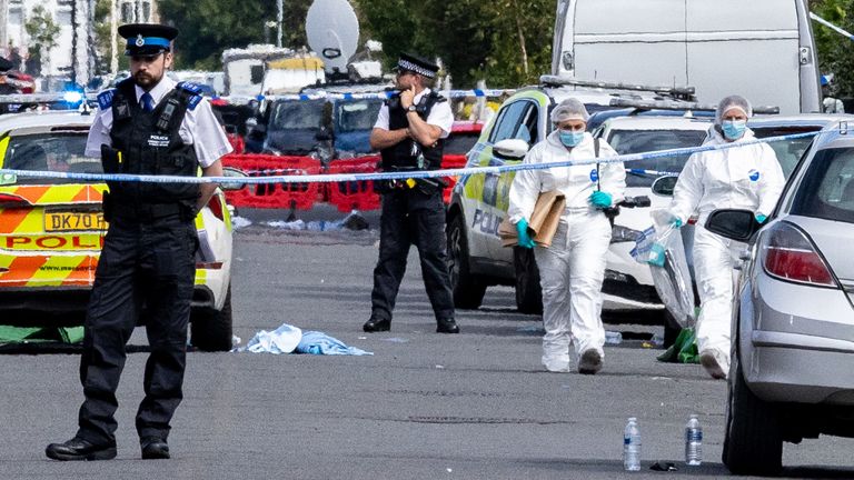 Policejní a forenzní důstojníci na místě smrtícího útoku v červenci 2024. Soubor Pic: PA